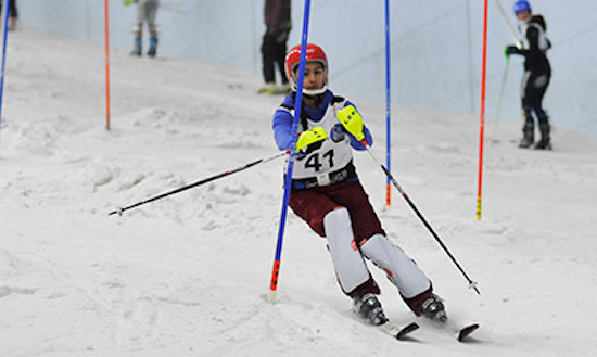 Ski racer skiing through gates