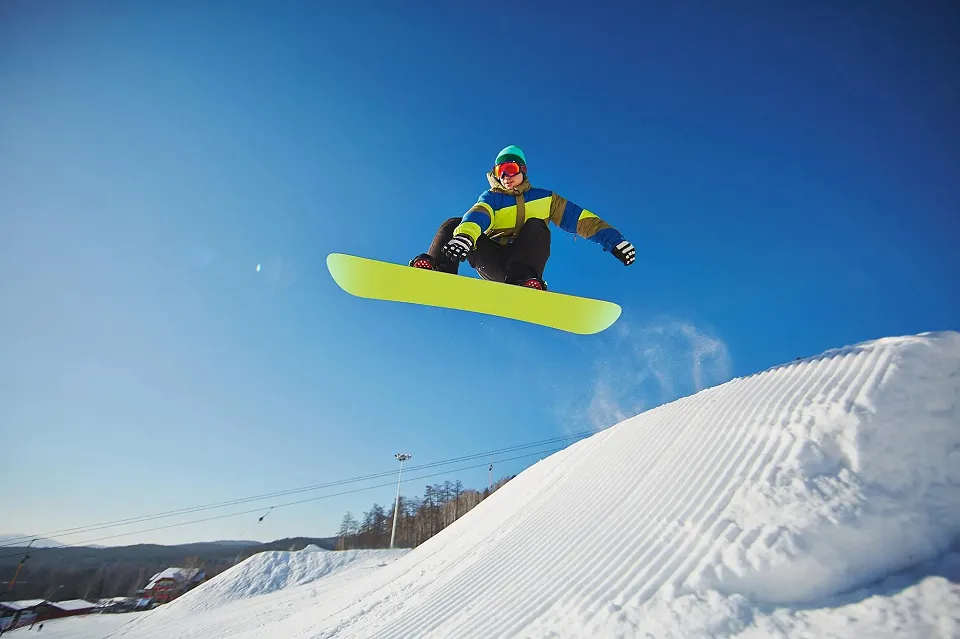 Snowboarder jumping through the air