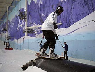 Snowboarder riding a pipe