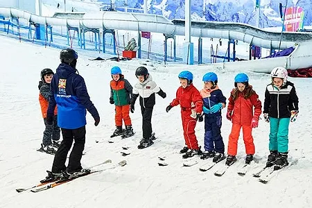Group of children enjoying a ski lesson at Chill Factor<sup>e</sup>