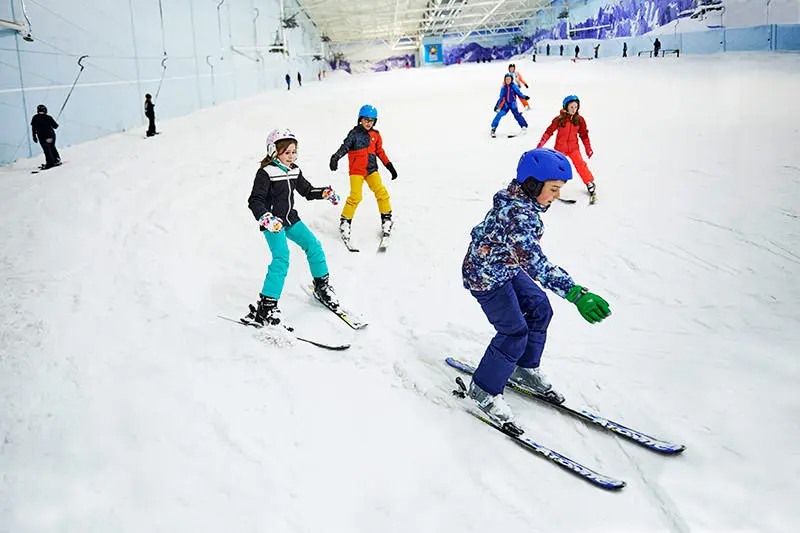 Children skiing on the main slope at Chill Factor<sup>e</sup>