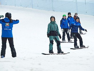 Snowboarders on a lessons at Chill Factor<sup>e</sup>
