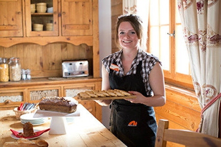 Female chalet host in kitchen