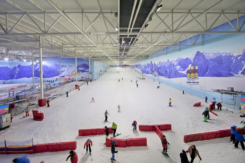 Aerial view of people skiing down the slope at chill factore indoor ski slope, Manchester